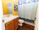 Cozy bathroom featuring a vanity and a shower with a playful curtain, creating a functional space at 14027 Bensbrook Dr, Spring Hill, FL 34609