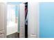A closet featuring white bi-fold doors, and shelving with clothing at 14027 Bensbrook Dr, Spring Hill, FL 34609