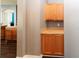 A view of kitchen cabinets that feature traditional wood and neutral countertops, offering practical storage at 14027 Bensbrook Dr, Spring Hill, FL 34609