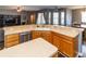 Open kitchen with a large island, stainless steel appliances, and breakfast bar at 14027 Bensbrook Dr, Spring Hill, FL 34609