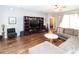 Comfortable living room features hardwood floors and an entertainment center at 14027 Bensbrook Dr, Spring Hill, FL 34609
