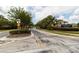Scenic neighborhood entrance with attractive signage and well-maintained landscaping, promoting a welcoming atmosphere at 14027 Bensbrook Dr, Spring Hill, FL 34609