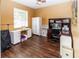 Bright office space with ample storage, modern desk setup, and hardwood floors perfect for working from home at 14027 Bensbrook Dr, Spring Hill, FL 34609