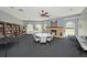 The well-appointed community room offers a cozy fireplace, library, and plenty of space for gatherings at 14181 Cornewall Ln, Spring Hill, FL 34609