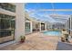 The beautiful pool area features an oversized deck, offering ample space for relaxation and entertaining at 14181 Cornewall Ln, Spring Hill, FL 34609