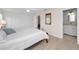 The bedroom features a ceiling fan, closet with louvered doors, and an adjacent bathroom at 14341 Passage Way, Seminole, FL 33776