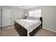 Spacious bedroom featuring a bed, light colored walls, and a ceiling fan at 14341 Passage Way, Seminole, FL 33776