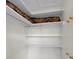 Walk-in closet with a sturdy rod and adjustable shelves, ready for organization at 14341 Passage Way, Seminole, FL 33776