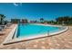 Large community pool with easy access and plenty of lounge chairs at Imperial Point at 14341 Passage Way, Seminole, FL 33776
