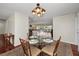 Charming dining area with glass table and views of the backyard at 14341 Passage Way, Seminole, FL 33776