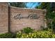 Imperial Point entrance sign with lush landscaping, set in a brick walled community at 14341 Passage Way, Seminole, FL 33776