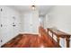 Inviting entryway with gleaming wood floors and stylish console table at 14341 Passage Way, Seminole, FL 33776