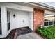 Charming entryway features a double door, brick accents, and well-maintained landscaping at 14341 Passage Way, Seminole, FL 33776