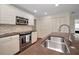 Well-equipped kitchen featuring stainless steel appliances and ample storage at 14341 Passage Way, Seminole, FL 33776