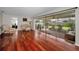 Bright living room with hardwood floors, a sitting area, and access to the backyard at 14341 Passage Way, Seminole, FL 33776