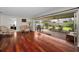Bright living room with hardwood floors and access to a covered outdoor patio at 14341 Passage Way, Seminole, FL 33776