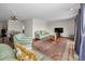 Open-concept living room with a dining area, comfortable seating, and stylish decor at 14341 Passage Way, Seminole, FL 33776