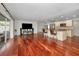 Open floor plan combining living and kitchen spaces featuring hardwood floors throughout at 14341 Passage Way, Seminole, FL 33776