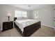 Inviting main bedroom with wood-look floors, a ceiling fan, and a full-size bed at 14341 Passage Way, Seminole, FL 33776
