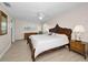 Spacious main bedroom with a ceiling fan, window, and dresser at 14341 Passage Way, Seminole, FL 33776