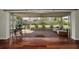 Covered patio with brick flooring, ample seating, and views of the backyard at 14341 Passage Way, Seminole, FL 33776