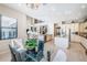 Open-concept design showing the dining area flowing seamlessly into the kitchen and living spaces at 14806 Harry Colt Ct, Tampa, FL 33626