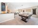 This fun game room features a pool table, wet bar, and comfortable seating for a perfect entertainment space at 14806 Harry Colt Ct, Tampa, FL 33626