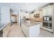 Well-appointed kitchen featuring custom cabinetry, granite countertops, and modern stainless-steel appliances at 14806 Harry Colt Ct, Tampa, FL 33626