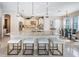 Gourmet kitchen with granite countertops, a large island, and stainless-steel appliances open to the dining area at 14806 Harry Colt Ct, Tampa, FL 33626