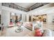 Spacious, open-concept living area with high ceilings and seamless flow into the kitchen and staircase at 14806 Harry Colt Ct, Tampa, FL 33626