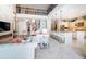 Open-concept living space with a view of the kitchen, staircase, and a two-story wrought iron railing at 14806 Harry Colt Ct, Tampa, FL 33626