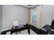 Home office with a dark wood desk, and a comfortable white chair, perfect for remote work at 14806 Harry Colt Ct, Tampa, FL 33626