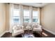 Cozy sitting area with plush armchairs and large windows offering lots of natural light at 14806 Harry Colt Ct, Tampa, FL 33626