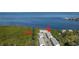 Aerial view of community featuring waterfront access, mature trees, and well-maintained buildings at 1500 Sunset Rd # C10, Tarpon Springs, FL 34689