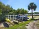Outdoor racks available for kayaks surrounded by a lush landscape and a view of the water at 1500 Sunset Rd # C10, Tarpon Springs, FL 34689