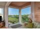Serene sun room boasting panoramic windows overlooking water, offering a tranquil retreat at 1500 Sunset Rd # C10, Tarpon Springs, FL 34689