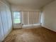 Cozy bedroom featuring carpet and natural light, creating a warm retreat at 1510 Mission Hills Blvd # 19-F, Clearwater, FL 33759