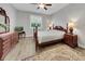 Bedroom featuring a bed, dresser with a mirror and a beautiful area rug at 1528 Highland Park Dr, Clearwater, FL 33756