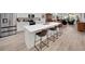 Modern kitchen features stainless appliances, a large island with seating, and open layout at 1528 Highland Park Dr, Clearwater, FL 33756