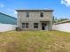 Spacious backyard with green grass and a full fence at 18320 Snowdonia Dr, Land O Lakes, FL 34638