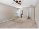 Carpeted bedroom offers easy access to an ensuite bathroom and walk-in closet at 18320 Snowdonia Dr, Land O Lakes, FL 34638