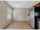 Bright dining area featuring tile flooring and a stainless steel refrigerator at 18320 Snowdonia Dr, Land O Lakes, FL 34638