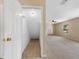 Spacious living room with neutral carpeting, natural light, and ceiling fan at 18320 Snowdonia Dr, Land O Lakes, FL 34638