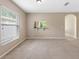 Cozy living room area with a large window offering a view to the outdoors at 18320 Snowdonia Dr, Land O Lakes, FL 34638