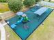 Aerial view of a modern playground with climbing structures, slides and covered picnic tables at 18320 Snowdonia Dr, Land O Lakes, FL 34638