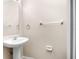 Simple powder room with white pedestal sink and neutral walls at 18320 Snowdonia Dr, Land O Lakes, FL 34638