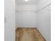 Walk-in closet with carpeted floors and metal shelving racks at 18320 Snowdonia Dr, Land O Lakes, FL 34638