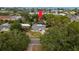 Overhead aerial view of a home with a pool and lush landscaping, indicating property layout at 2048 Douglas Ave, Dunedin, FL 34698