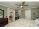 Bedroom featuring neutral paint, ceiling fan, and an open doorway to the kitchen at 2048 Douglas Ave, Dunedin, FL 34698