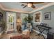 Florida room with slate floors, decorative plants, a view of the kitchen, and a ceiling fan at 2048 Douglas Ave, Dunedin, FL 34698